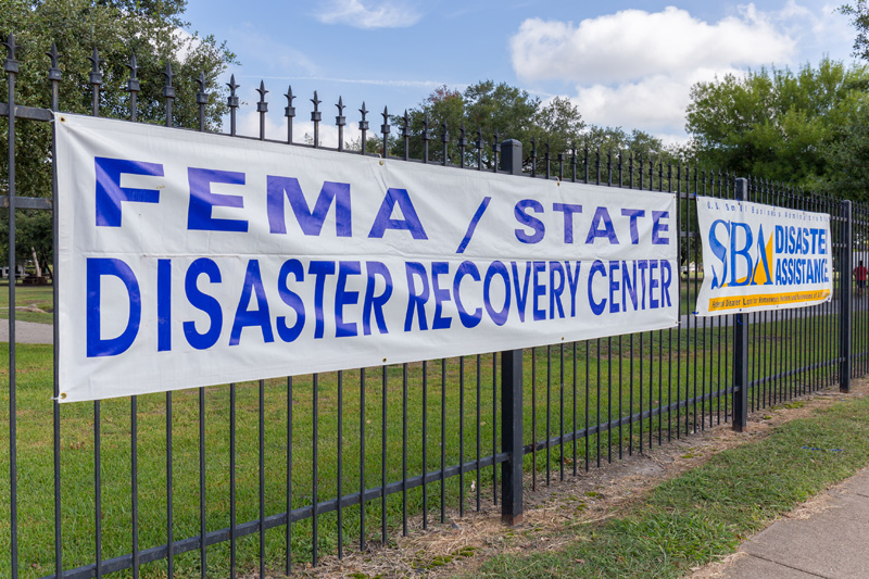 FEMA and SBA Disaster Recovery Banners on a fence